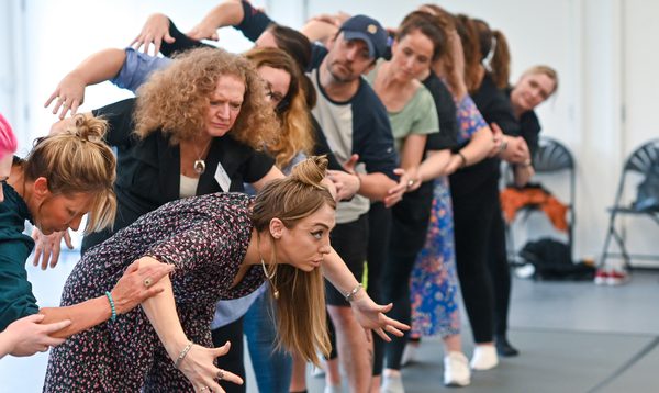 creative insights 2025 participants line up in a movement exercise