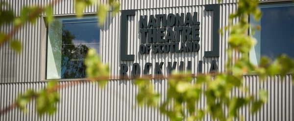 A grey building with large windows