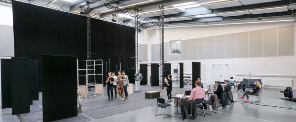 People working in a rehearsal space
