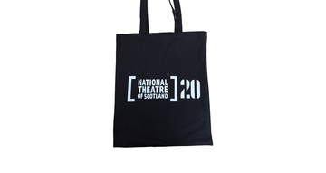 A black tote bag with the text "National Theatre of Scotland 20"
