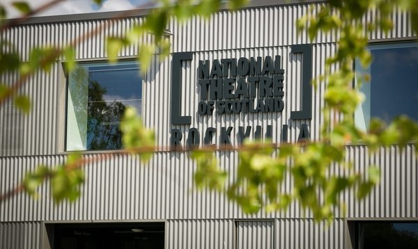 The exterior of the NTS Rockvilla building through the tree branches