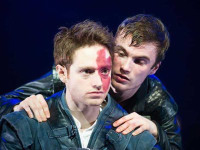 A young man creeps up behind the young king james