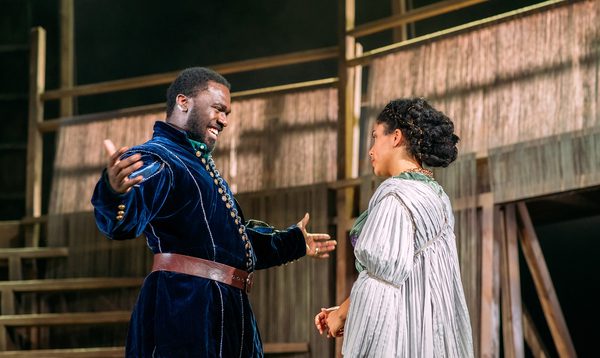 actor Thierry Mabonga with arms spread wide, smiling and actress Danielle Jam facing him.
