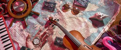 Shows a map with several items on it including a pair of sunglasses, tapes, and a violin