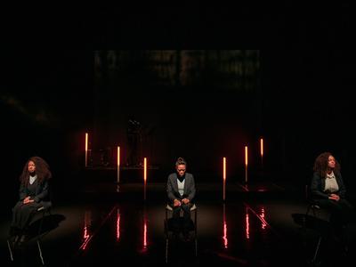 Three women sit looking down with their hands in their laps