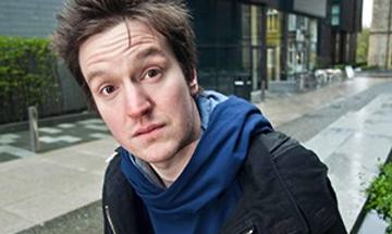 Photograph of a man with spikey brown hair