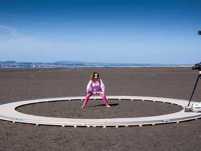 Woman dancing on the beach