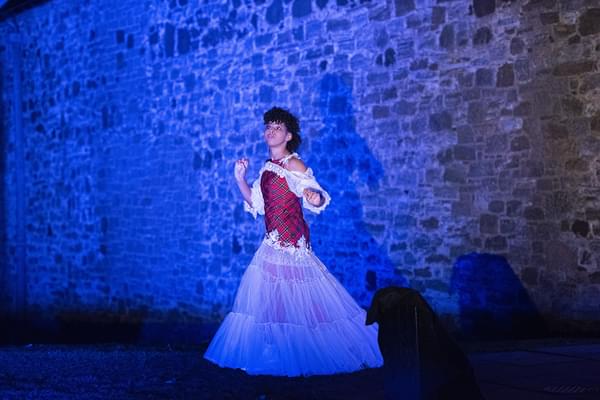 Amber as Rapunzel at Stirling Castle, wearing a dress with a red tartan bodice