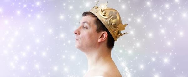 A person in profile wearing a crown and holding their chin up