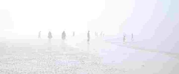 Distorted picture of figures on a beach