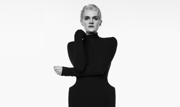 Black and white photo of Gayle Rankin. She wearing a black turtleneck dress.