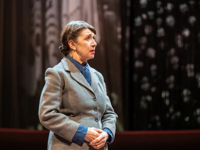 Maureen Beattie wears a grey suit and looks very concerned.