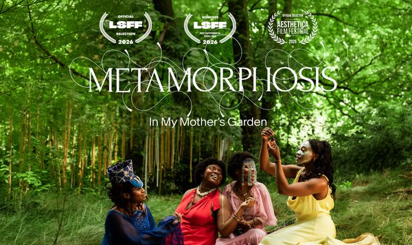 Four women lie in the grass, film festival laurels are in the trees above them
