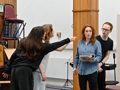 Jo Freer looks mildly surprised as Aron Dochard stares at her in confusion and Hannah and Chiara point at her.